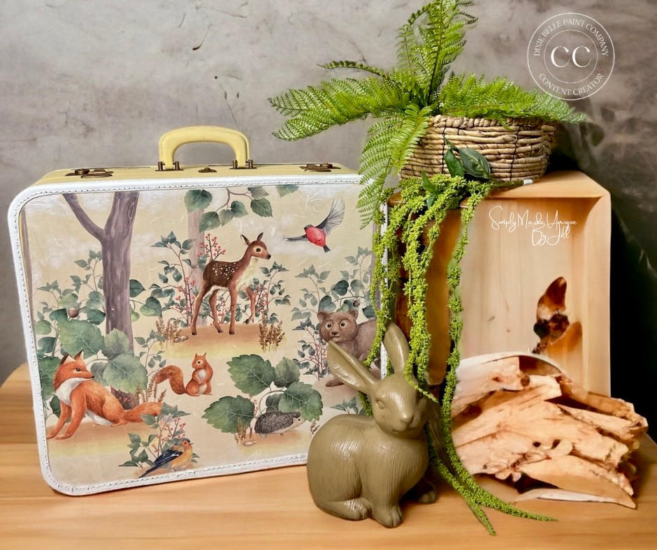 Belles and Whistles Woodland Nursery - A1 Rice Decoupage Paper. Suitcase with Woodland Decoupage Rice paper applied with olive green rabbit and plant for staging
