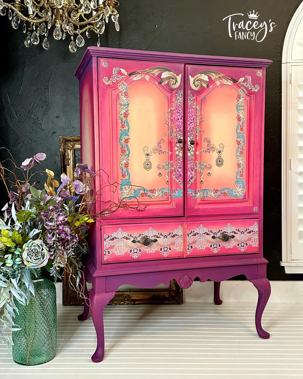 Purple, pink, and yellow painted armoire. The Gilded Age Transfer has been applied to the doors and drawers
