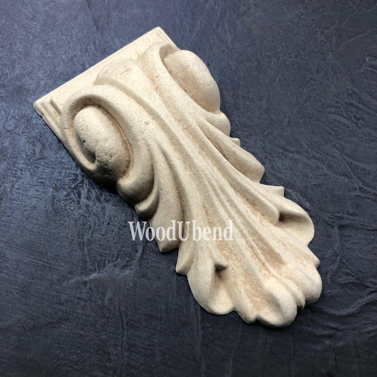 WoodUBend Applique #6022 (Set of 2) is the perfect mouldable embellishment for any project! One Applique #6022 (Set of 2) against a black background.