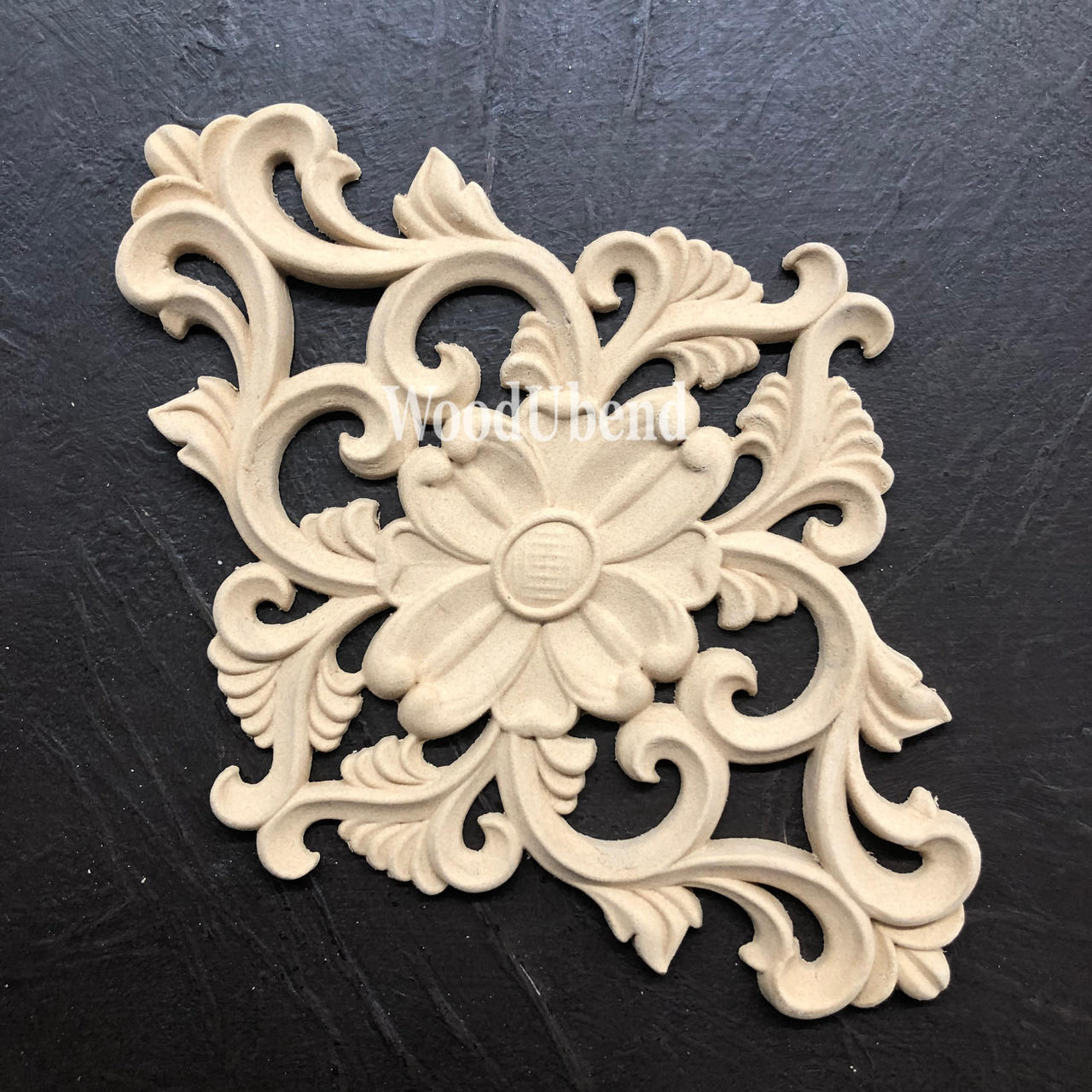 WoodUBend Floral Applique #2157 (set of 2)
This is just one of the Appliques is laying out, diagonally, on a crinkled, black leather surface.