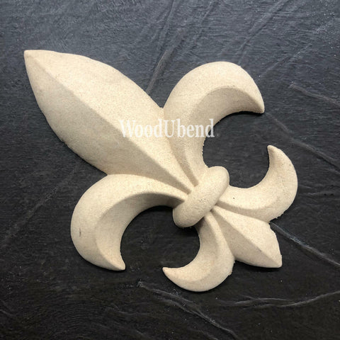 WoodUBend Fleur-de-lis Applique #X1011 (Set of 2) is the perfect mouldable embellishment for any project!
One of the Fleur-de-lis Applique #X1011 (Set of 2) staged flat on a black crinkled background.