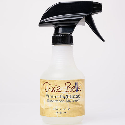 8 oz. spray bottle labeled 'Dixie Belle White Lightning' on a white background