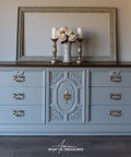 Gray dresser with decorative elements in a room setting