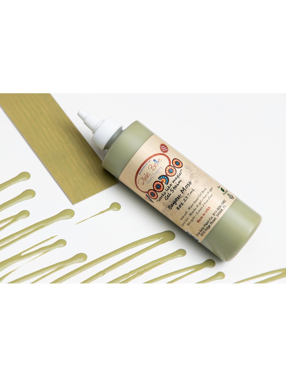 Image of Bayou Moss Voodoo Gel Stain bottle, next to it's respective stain sample card, along with lines of the stain on a white background.