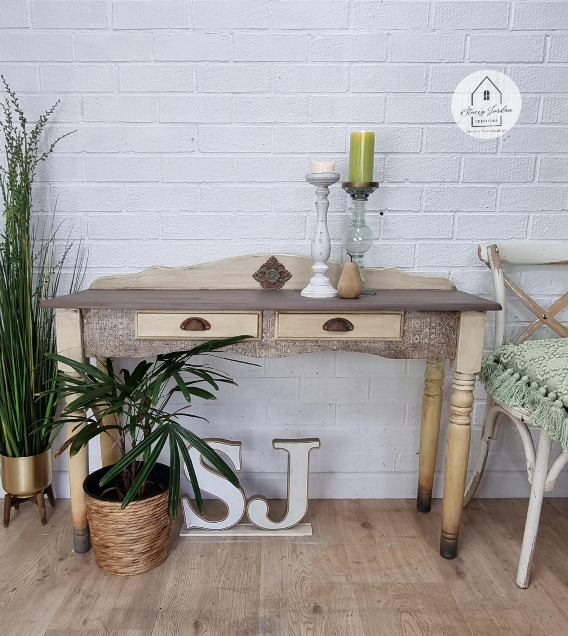Belles and Whistles Ancient Mud Cloth - A1 Rice Decoupage Paper is a simple way to visually enhance any surface of your project! Natural wood desk with dark wooden hardware and feet. The base of the dresser was finished with the Ancient Mud Cloth decoupage and is staged with large wooden initials and two potted plants.