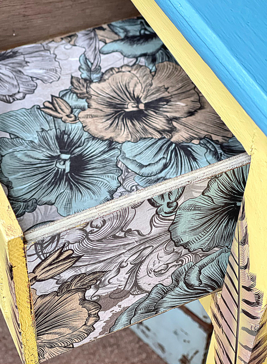 Belles and Whistles Blue and Yellow Floral - Rice Decoupage Paper is a simple way to visually enhance any surface of your project! View of the inside and outside of a drawer lined with Blue and Yellow Floral - Rice Decoupage Paper.