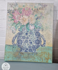 Belles and Whistles Blue Glass Ornate - Rice Decoupage Paper is a simple way to visually enhance any surface of your project! Beautiful painting of a vase using the  Blue Glass Ornate - Rice Decoupage Paper with yellow, pink flowers, and green leaves inside of vase.
