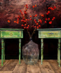 Belles and Whistles Botanical - Silkscreen Stencil provides an extra decorative touch to any project!
A bedside table set in green distressed style with the Botanical - Silkscreen Stencil around the drawers in yellow. Staged in front of a black and red background and wooden floors.