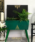 Belles and Whistles Botanical - Silkscreen Stencil provides an extra decorative touch to any project!
Vintage sewing box painted in Tree Frog Green Chalk Mineral Paint with Best Dang Wax! in Black to tone it down along with Anchor in the Silk All-in-One Paint on the inside of the piece. Botanical - Silkscreen Stencil is seen on the center of the piece in a gold paint as well as on the inside of the top. Staged with greenery on the inside and the outside, as well as a candle pedestal with a white candle.