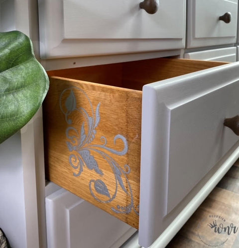 Belles and Whistles Butterflies - Silkscreen Stencil provides an extra decorative touch to any project!
The side panel of a drawer using Butterflies - Silkscreen Stencil in gray.