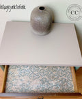 Belles and Whistles Distressed Damask - A1 Rice Decoupage Paper 
This is side table with the drawer opened.  The distressed-damask decoupage is on the bottom of the drawer.  There is a brown, smooth vase on top of the side table.