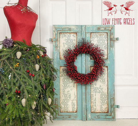 Belles and Whistles Distressed Damask - A1 Rice Decoupage Paper 
There is an old window frame that is painted with sea glass CMP and is very distressed. Where the windows would be, there is distressed-damask decoupage.  There is a dried, cranberry wreath attached to the window frame.  To the left of the window frame is a read mannequin.  As here skirt there are evergreen sprigs with colorful, plastic berries, white pinecones and a purple flower as decorations