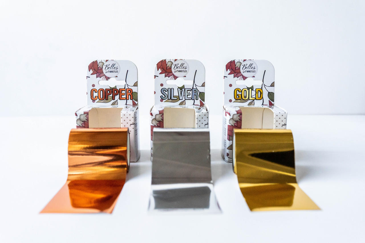 Belles and Whistles Dixie Shine 
Three rolls of Dixie Shine in each color with their appropriate packaging behind each roll. Staged on a white background.