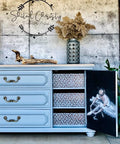 Belles and Whistles Enchanted Garden - Stencil provides an extra decorative touch to any project! Light blue painted dresser with gold handles. Floral Ballerina A1 Rice Decoupage Paper applied to the inside of the cabinet door. Enchanted Garden stencil design applied inside on the sliding drawer fronts. Staged with a large piece of driftwood and silver metal vase on top.
