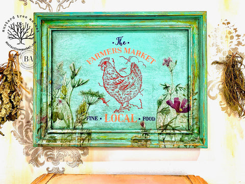 Belles and Whistles Farmhouse - Silkscreen Stencil provides an extra decorative touch to any project! Green picture frame with The Farmers Market, chicken, and Fine Local Food Silkscreen design applied in blue, orange and red.