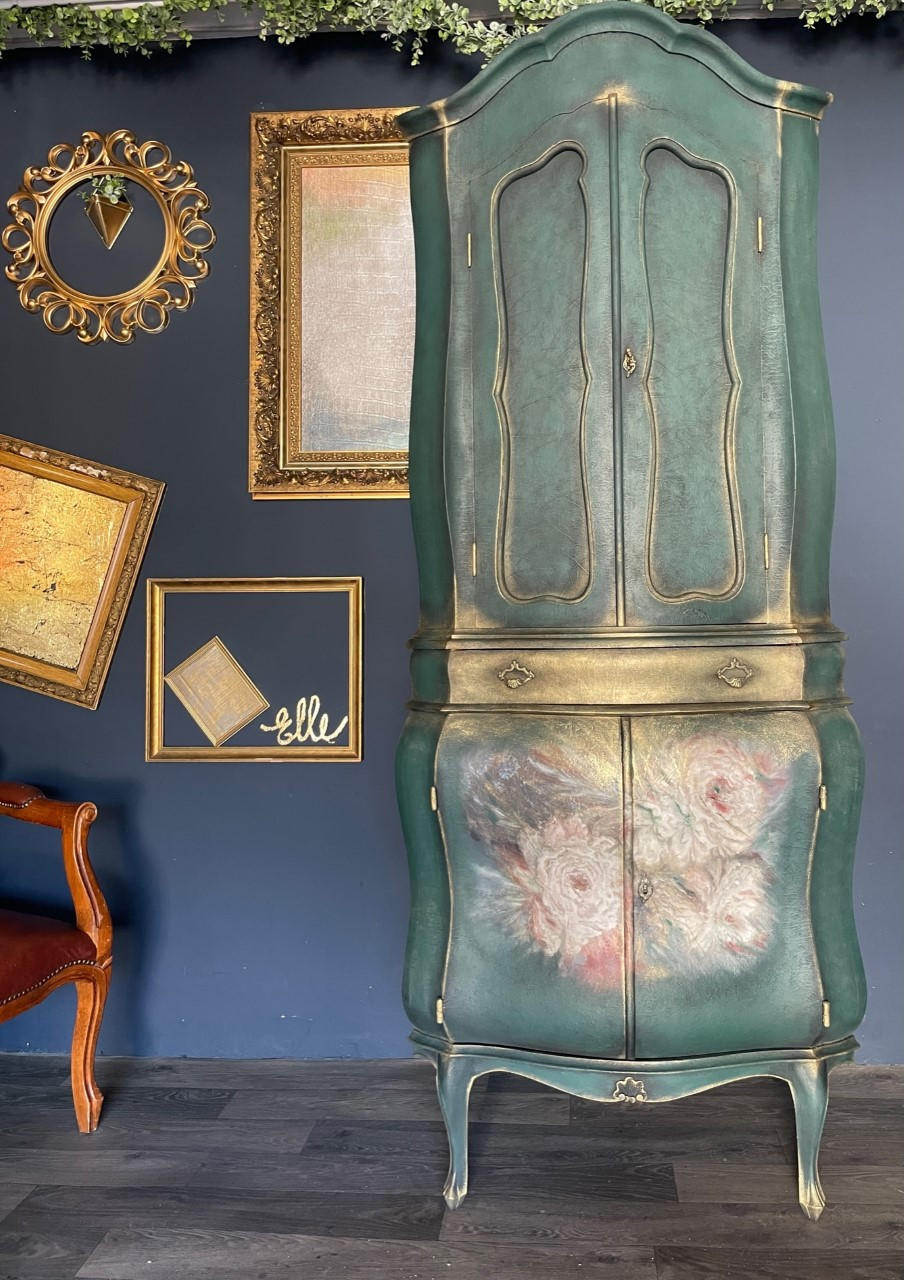 Belles and Whistles Floral Ballerina - A1 Rice Decoupage Paper is a simple way to visually enhance any surface of your project!
Tall green wardrobe with the middle drawer accented gold. Bottom piece of wardrobe has Floral Ballerina - A1 Rice Decoupage Paper  on door panels.