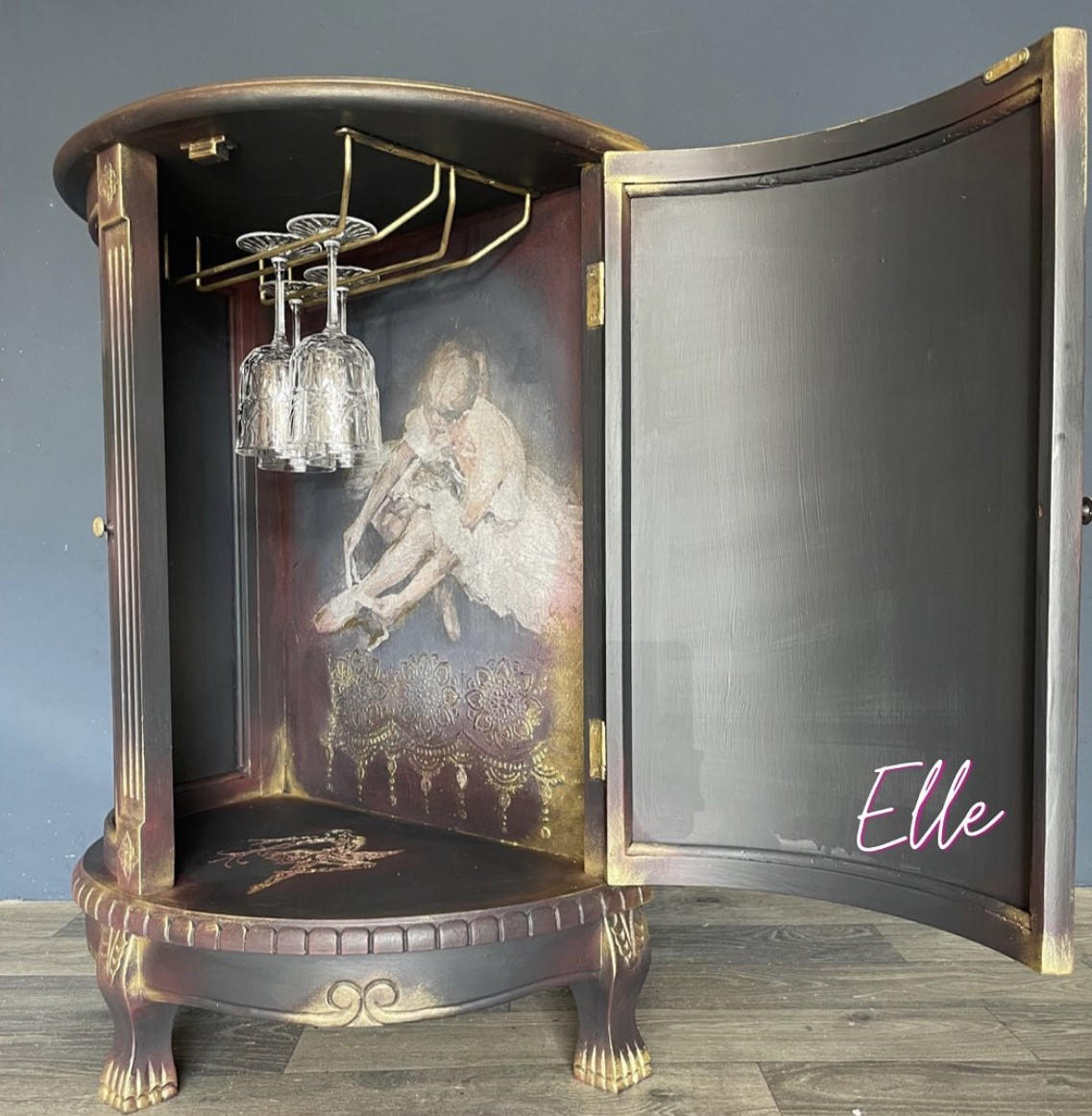 Belles and Whistles Floral Ballerina - A1 Rice Decoupage Paper is a simple way to visually enhance any surface of your project!
Image of inside a brown bar with fold accents around woodwork with the Floral Ballerina - A1 Rice Decoupage Paper  covering the inside of bar. Inside car is seen a metal rail that are holding 4 wine cups.