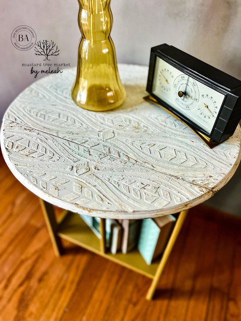 Belles and Whistles Geometric Moderne - Stencil provides an extra decorative touch to any project! End table with Geometric Moderne - Stencil used on top with Dixie Mud to give it a raised effect. Staged with radio and yellow glass vase.