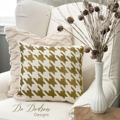 Belles and Whistles Houndstooth - Stencil provides an extra decorative touch to any project!
An image of a white pillow with the Houndstooth - Stencil using gold on the pillow. Staged on top of a cushioned white chair and a bigger white decorative pillow behind the first.