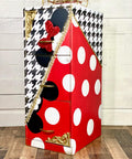 Belles and Whistles Houndstooth - Stencil provides an extra decorative touch to any project!
A file cabinet with half diagonally the cabinet in red with white polka dots and black mouse ears, on the other side is a white base with black Houndstooth - Stencil on top with black mouse ears with a red bow. In Between the two sides is a gold separator.