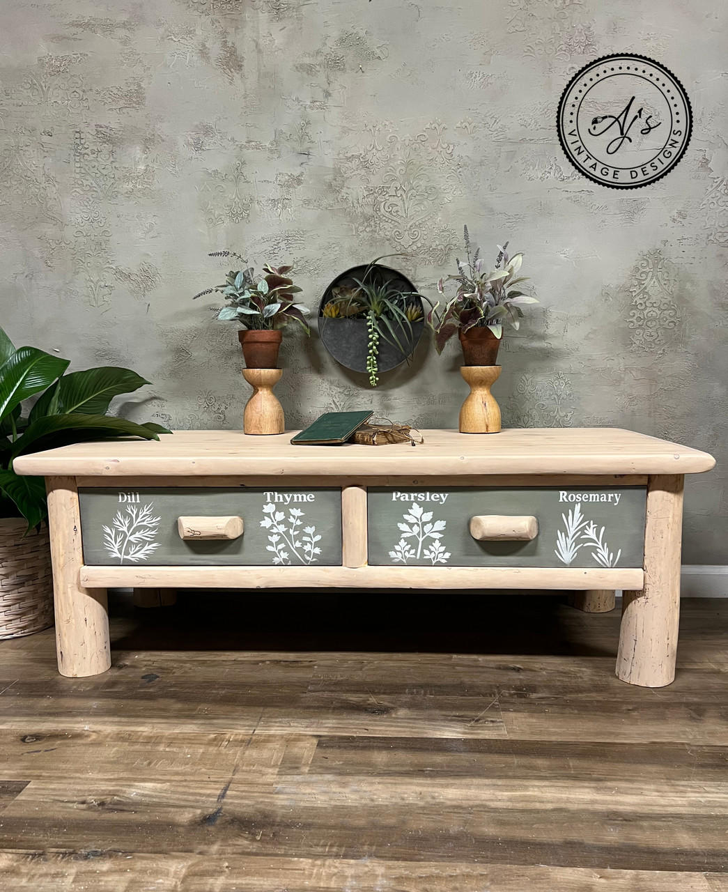 Belles and Whistles Locally Grown - Stencil provides an extra decorative touch to any project! Natural log driftwood table with green paint on the drawer fronts and wooden handles. "Dill" and "Thyme" have been applied in white paint with their corresponding herb stencil on the left drawer front. "Parsley" and "Rosemary" have been applied with their corresponding herb stencil on the right drawer front.