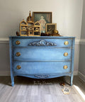 Belles and Whistles Morocco - Stencil provides an extra decorative touch to any project! 
Blue Chalk painted dresser with gold hardware, and light blue chalk painted morocco stencil on the front. Staged with pictures and a birdcage.
