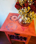 Belles and Whistles Mosaic - Silkscreen Stencil provides an extra decorative touch to any project! Red end table painted with Belles and Whistles Mosaic Silkscreen Stencil on top. Staged with Florals and glass vase.