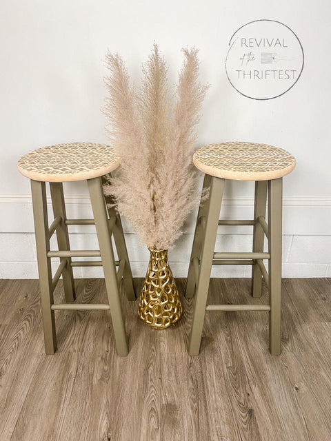 Belles and Whistles Mudcloth - Stencil provides an extra decorative touch to any project! Pair of stools painted in a light green with natural wood on the top and a stencil painted on. Staged with gold vase and wheat plants.
