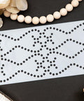 Belles and Whistles Nailhead Trim - Stencil provides an extra decorative touch to any project! Nailhead trim stencil laid out with Leaves and wooden beads.