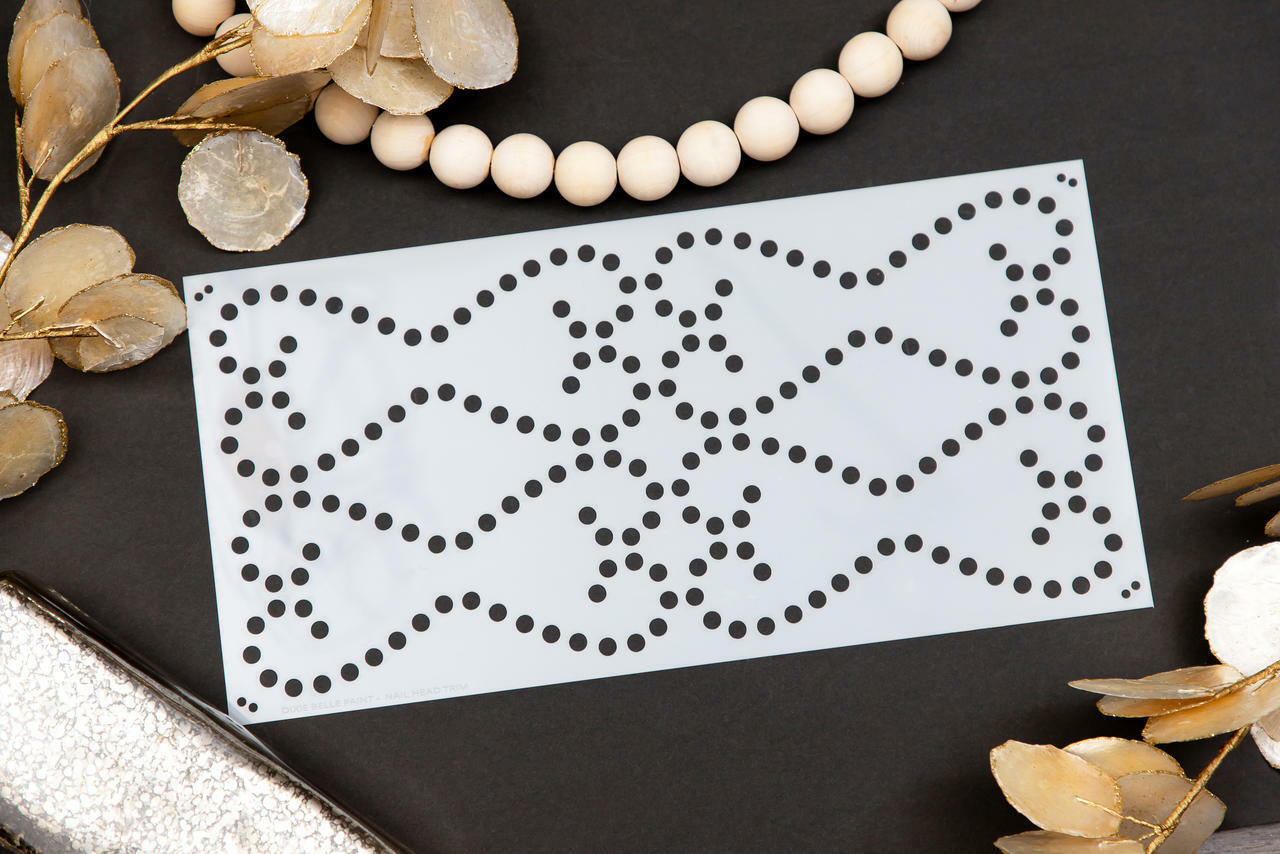 Belles and Whistles Nailhead Trim - Stencil provides an extra decorative touch to any project! Nailhead trim stencil laid out with Leaves and wooden beads.