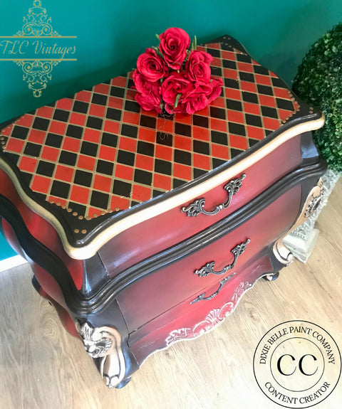 Belles and Whistles Nailhead Trim - Stencil provides an extra decorative touch to any project! Red and black end table with Checkered stencil on top and Nailhead trim stencil on the corners. Staged with a red rose.