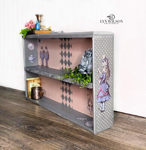 Belles and Whistles Patterns - Silkscreen Stencil provides an extra decorative touch to any project! Gray chalk painted book case with Alice rub on transfers and Polk a dot pattern stencil on the side. Staged with books and florals.