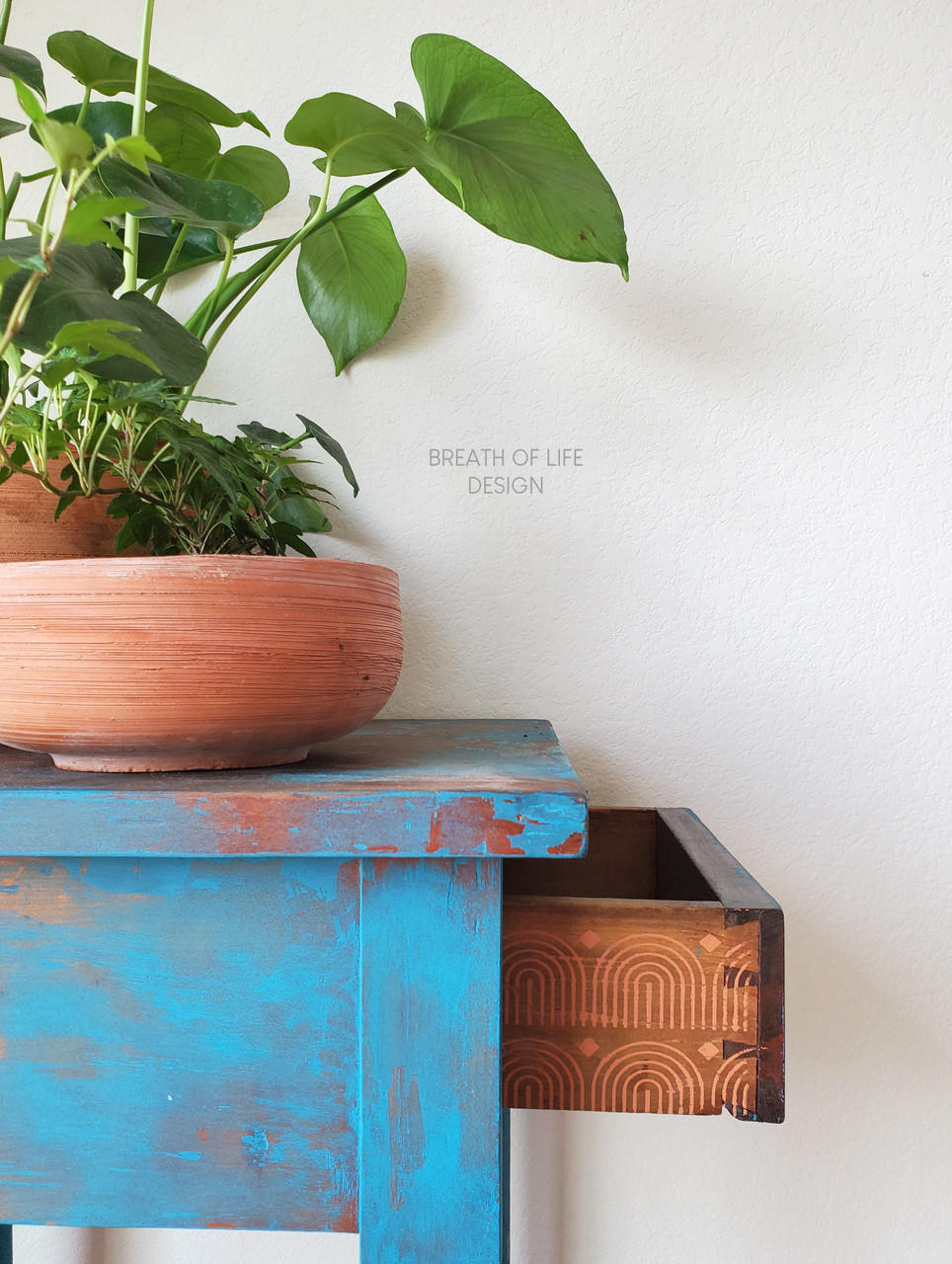 Belles and Whistles Patterns - Silkscreen Stencil provides an extra decorative touch to any project! Blue chalk painted end table with rainbow pattern stencil painted on the side of the drawers.
