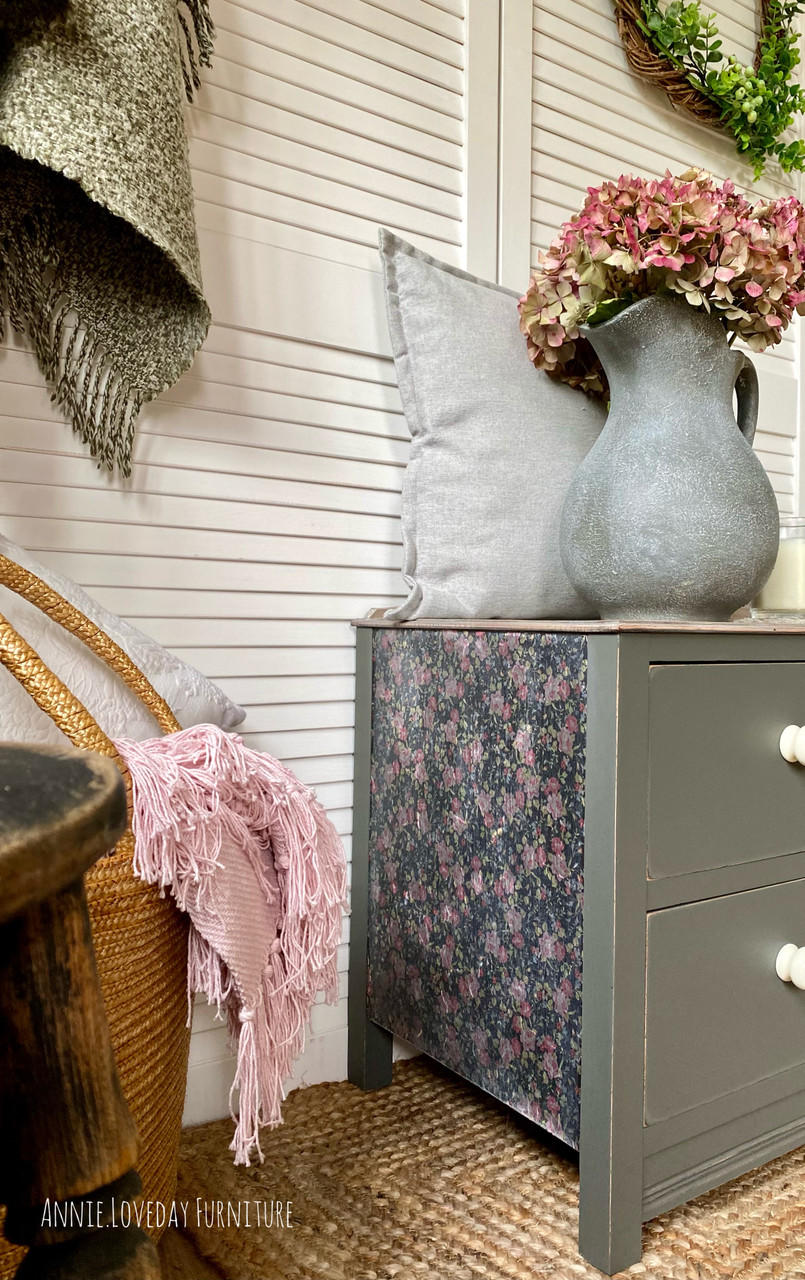 Belles and Whistles Peony Pattern - A1 Rice Decoupage Paper is a simple way to visually enhance any surface of your project! Side view of a green end table with  Peony Pattern Rice Decoupage Paper placed on the side. staged with a gray pitcher and pink flowers.