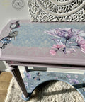 Blue and pink painted entryway table. The Alice Part 2 and Translucent Garden transfer have been applied to the table. The Royal Damask stencil has been applied to the table top also in white.