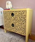 Belles and Whistles Safari - Stencil provides an extra decorative touch to any project! A yellow side table with 2 drawers featuring the cheetah stencil on the front painted in black.