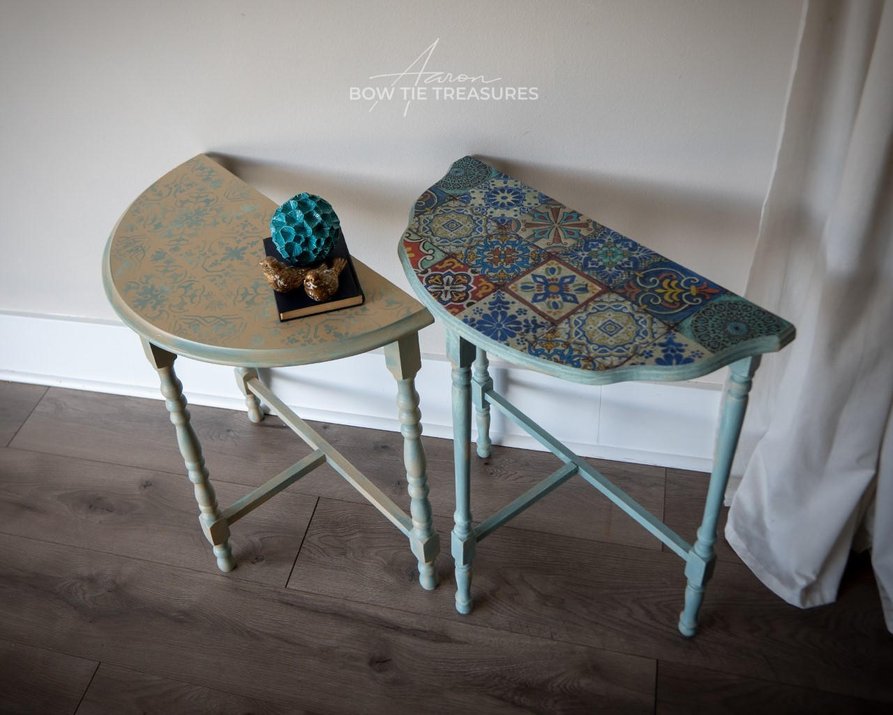 Belles and Whistles Sonoma Art Tile - Stencil provides an extra decorative touch to any project! 2 half-moon hallway tables, one with a washed top with the sonoma art tile stencil on the top in blue and the legs are painted in blue. The second table has a Mediterranean table top  and blue legs as well.
