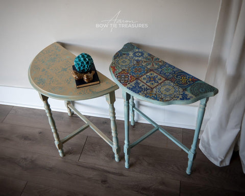 Belles and Whistles Sonoma Art Tile - Stencil provides an extra decorative touch to any project! 2 half-moon hallway tables, one with a washed top with the sonoma art tile stencil on the top in blue and the legs are painted in blue. The second table has a Mediterranean table top  and blue legs as well.