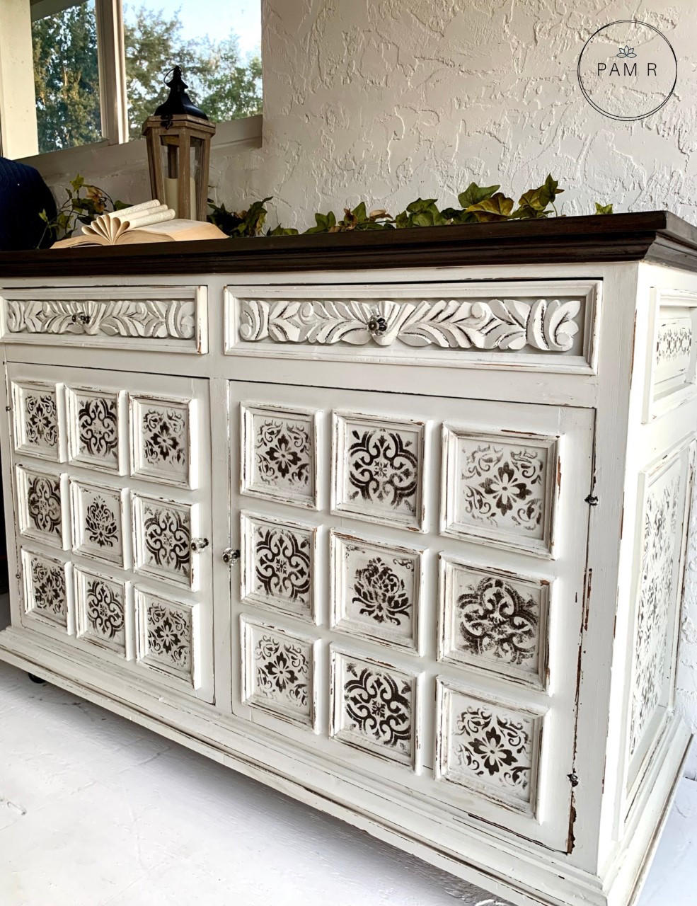 Belles and Whistles Sonoma Art Tile - Stencil provides an extra decorative touch to any project! A dresser painted in white with the sonoma art tile stencil featured on the front in brown.