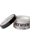Belles and Whistles Stick With Me 
Opened 3.38 ounce container of Stick With Me on a white background. The lid is leaning against jar.