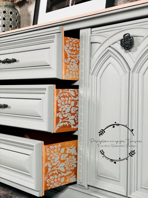 Belles and Whistles Tea Towel Floral - Stencil 
Shows the outside of three drawers to a large white farmhouse dresser with Tea Towel Floral - Stencil  in a white paint to decorate drawers.