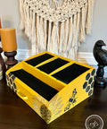 Belles and Whistles The Bee's Knees - Stencil provides an extra decorative touch to any project!  A yellow and black painted desk top caddy with the Bee's Knees stencil applied to the outside of it in black and brown chalk paint.