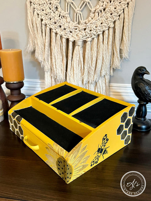 Belles and Whistles The Bee's Knees - Stencil provides an extra decorative touch to any project!  A yellow and black painted desk top caddy with the Bee's Knees stencil applied to the outside of it in black and brown chalk paint.