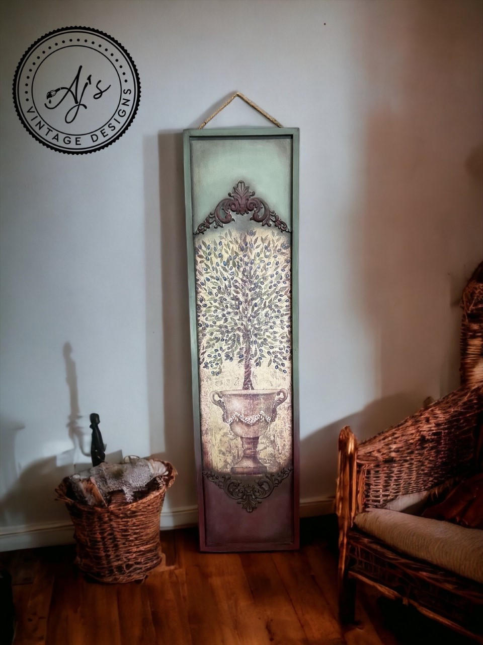 Large painted vertical wooden board. The Tuscan Olive Tissue Decoupage Paper has been applied on the front middle of the board with appliques applied above and below the design.