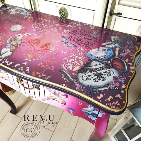 Belles and Whistles Victorian Damask - Stencil provides an extra decorative touch to any project!  A pink and white chalk painted and blended desk.  The Victorian Damask stencil is chalk painted in orange and white mixed colors to the top of the desk.  Alice rub on transfers are applied to the top and front o fthe desk. Staged on a light wooden floor.