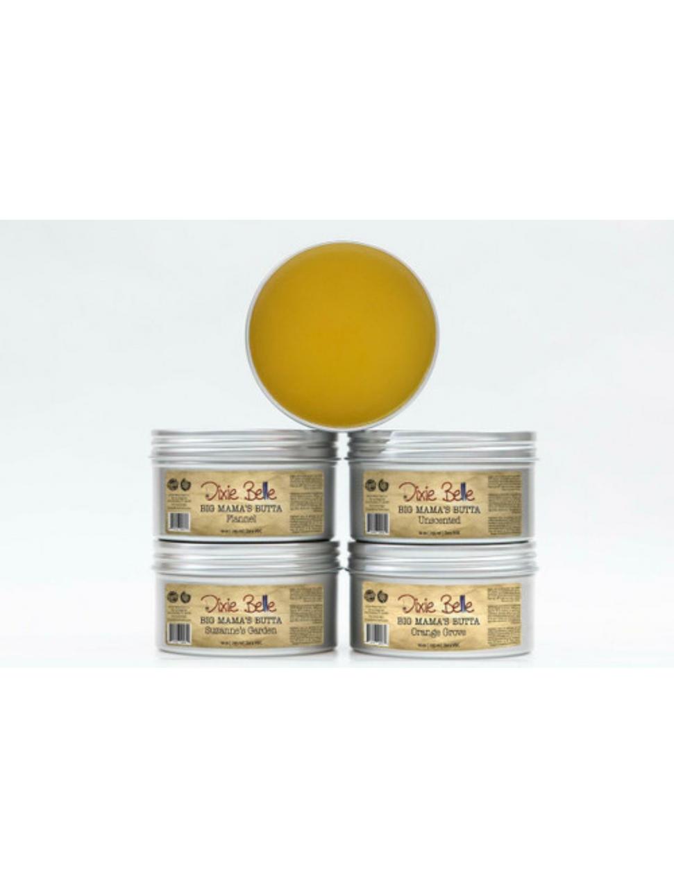Dixie Belle Paint Big Mama's Butta is a product used to neutralize odors and enhance wood grain. Image of all the Big Mama's Butta stacked on top of each other with one container on top of pyramid without a lid and facing forward showing the inside of the product.