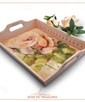 Pink painted serving tray with the Blushing Roses Decoupage Paper applied on the inside. The Bone Inlay Stencil has also been used on the inside edges of the tray in a darker pink. Staged with 2 faux peach colored roses.