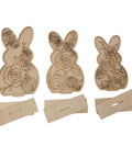 Three wooden bunny-shaped cutouts with floral cutout patterns, each accompanied by a rectangular stand. The intricate designs feature roses and other flowers, adding a decorative touch to the standing bunnies.