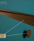 Dixie Belle Bronze Patina Paint. Close-up of a drawer featuring teal paint with a bronze patina finish. A round, textured bronze knob is visible. There's a label pointing to the painted surface, indicating "Bronze Patina Paint." The top left corner says "Gracie's House Painted Furniture.