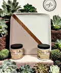 Wooden tray painted half with Cobblestone Chalk Mineral Paint and half with Cucumber Ice Chalk Mineral Paint. Staged with succulents surrounding the paint jars and wooden tray.